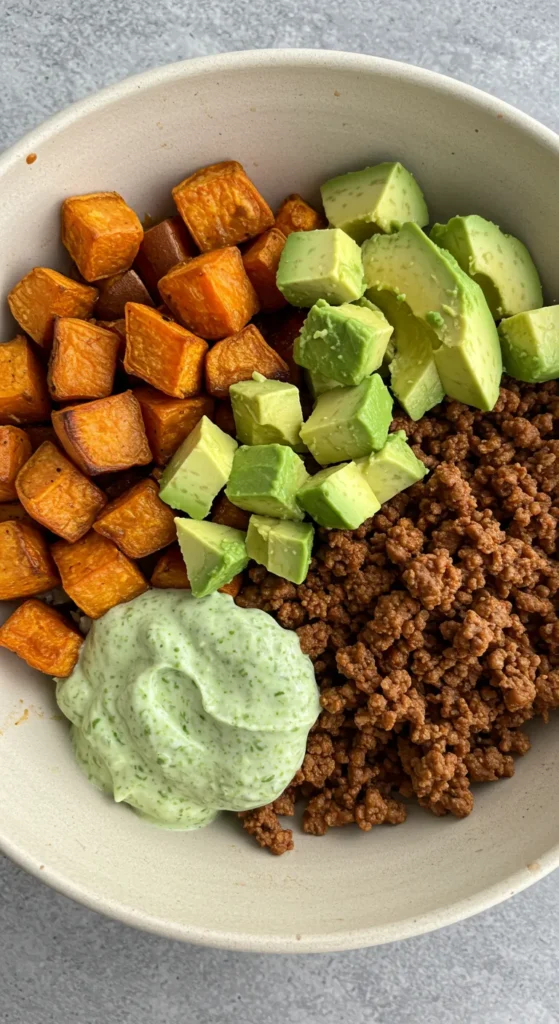 How To Make Easy Sweet Potato Taco Bowl Recipe 13 Sweet Potato Taco Bowl with a focus on easy-to-love vegetables, black beans, and a small amount of seasoned ground beef.