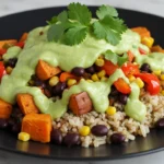 How To Make Easy Sweet Potato Taco Bowl Recipe 10 Close-up of a vibrant Sweet Potato Taco Bowl with roasted sweet potatoes, black beans, corn, avocado, and creamy cilantro-lime dressing.